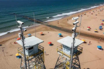 High-tech surveillance cameras monitoring a beach scene