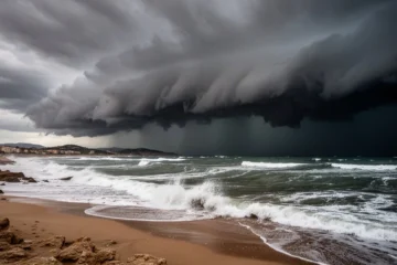 Storm clouds gathering over a beach in Catalonia with rough seas